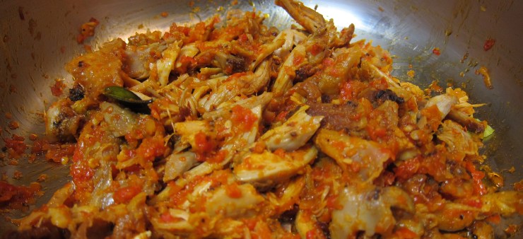Shredded chicken mixed in chili peppers